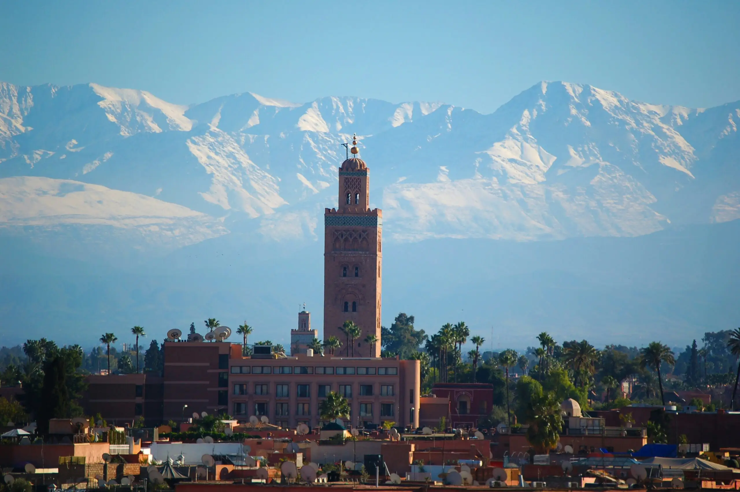 Mountain backdrop with a city skyline.