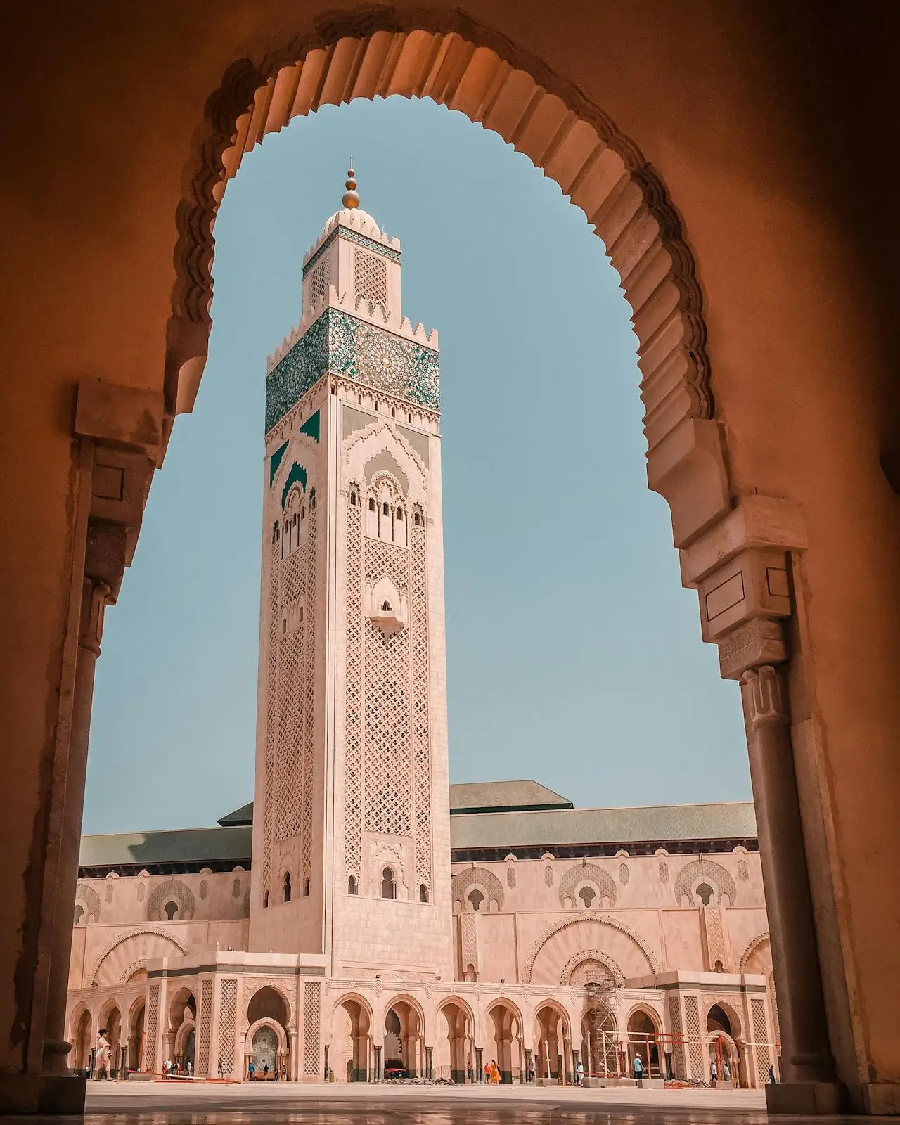 “Hassan II Mosque entrance with detailed Moroccan Islamic architecture in Casablanca.